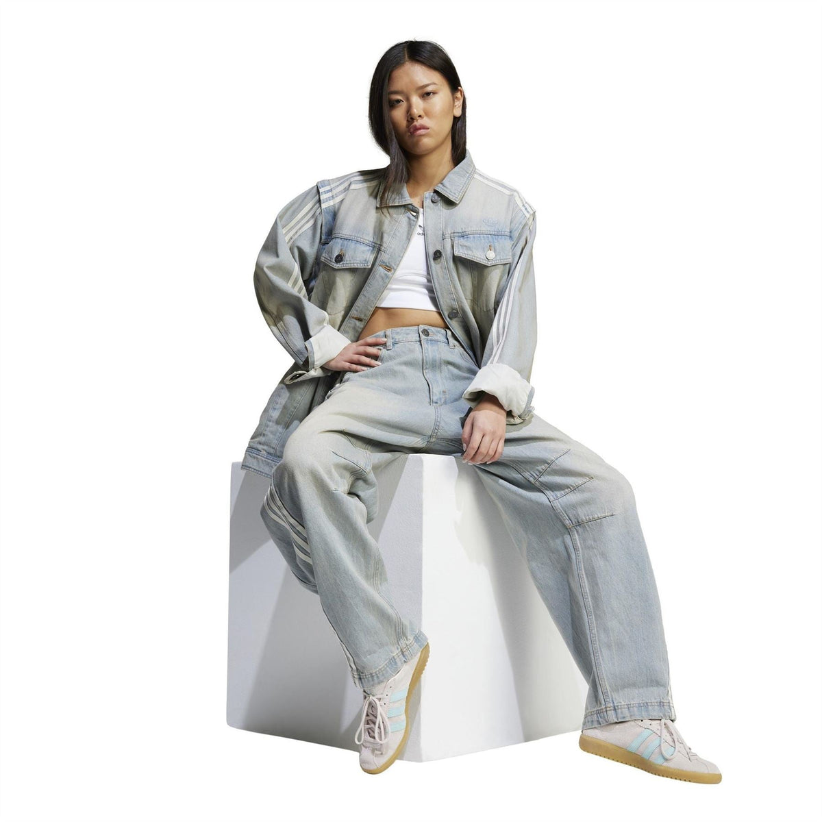adidas Originals light denim collared jacket with side stripes, worn with jeans and sneakers