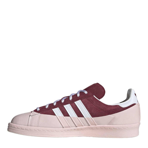 Burgundy and off-white low-top lace-up trainers with three white side stripes