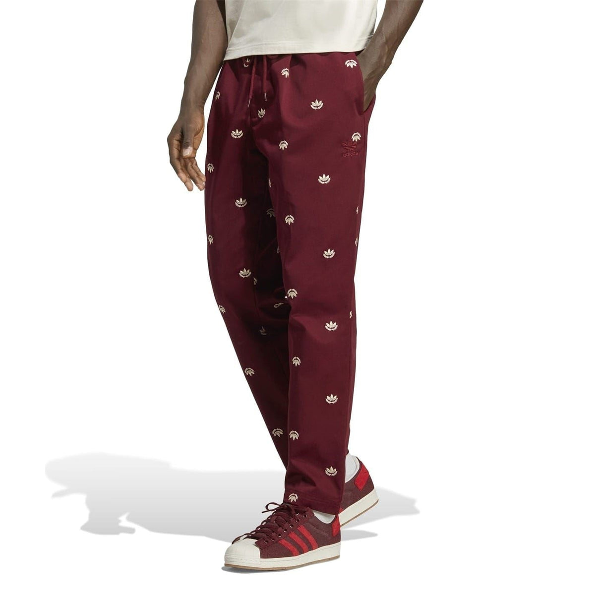 adidas Originals burgundy patterned chino pants with drawstring waist and straight legs