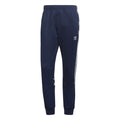 Navy athletic track pants with side stripes and adidas logo, regular fit