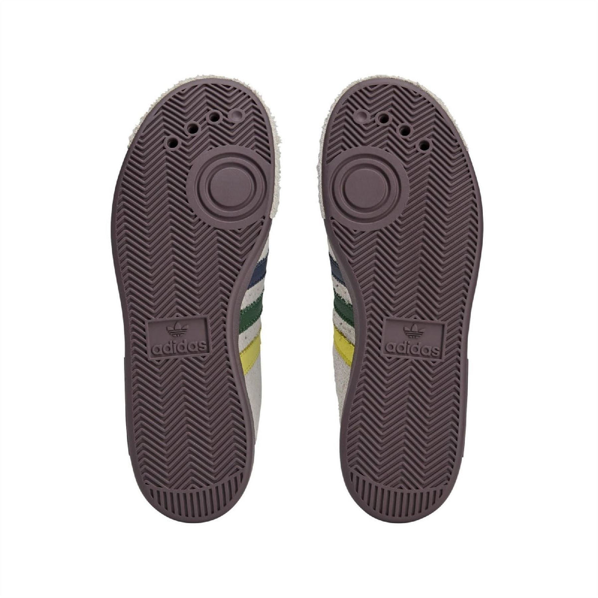 Brown rubber outsole for cream low-top sneakers with adidas logo and tread