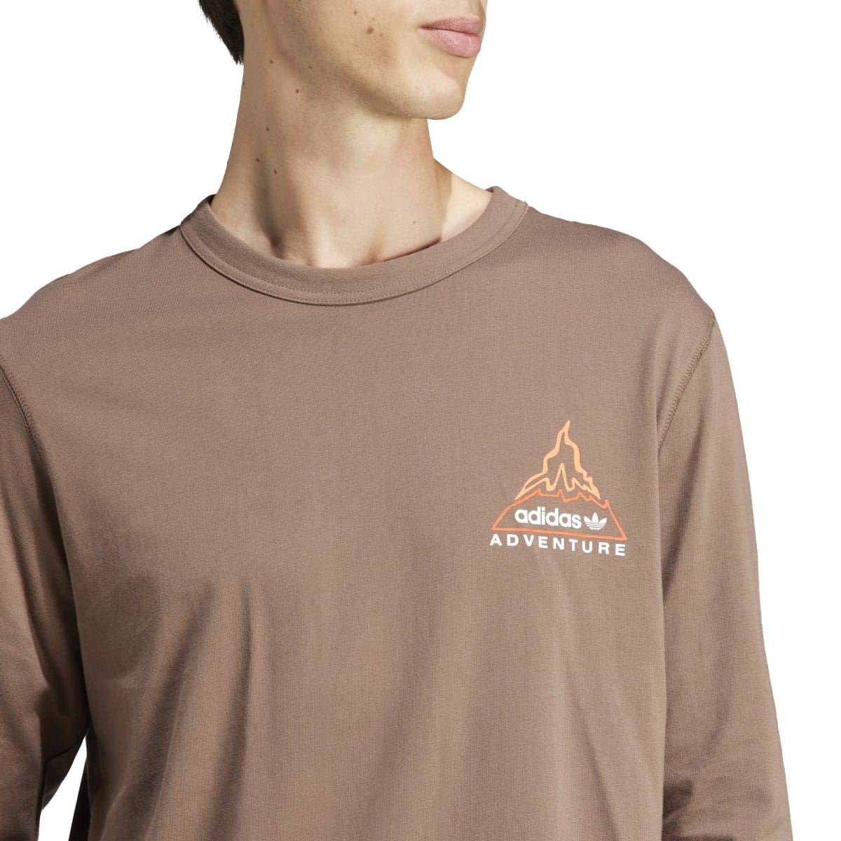 adidas Originals brown long-sleeve T-shirt close-up of chest adventure graphic