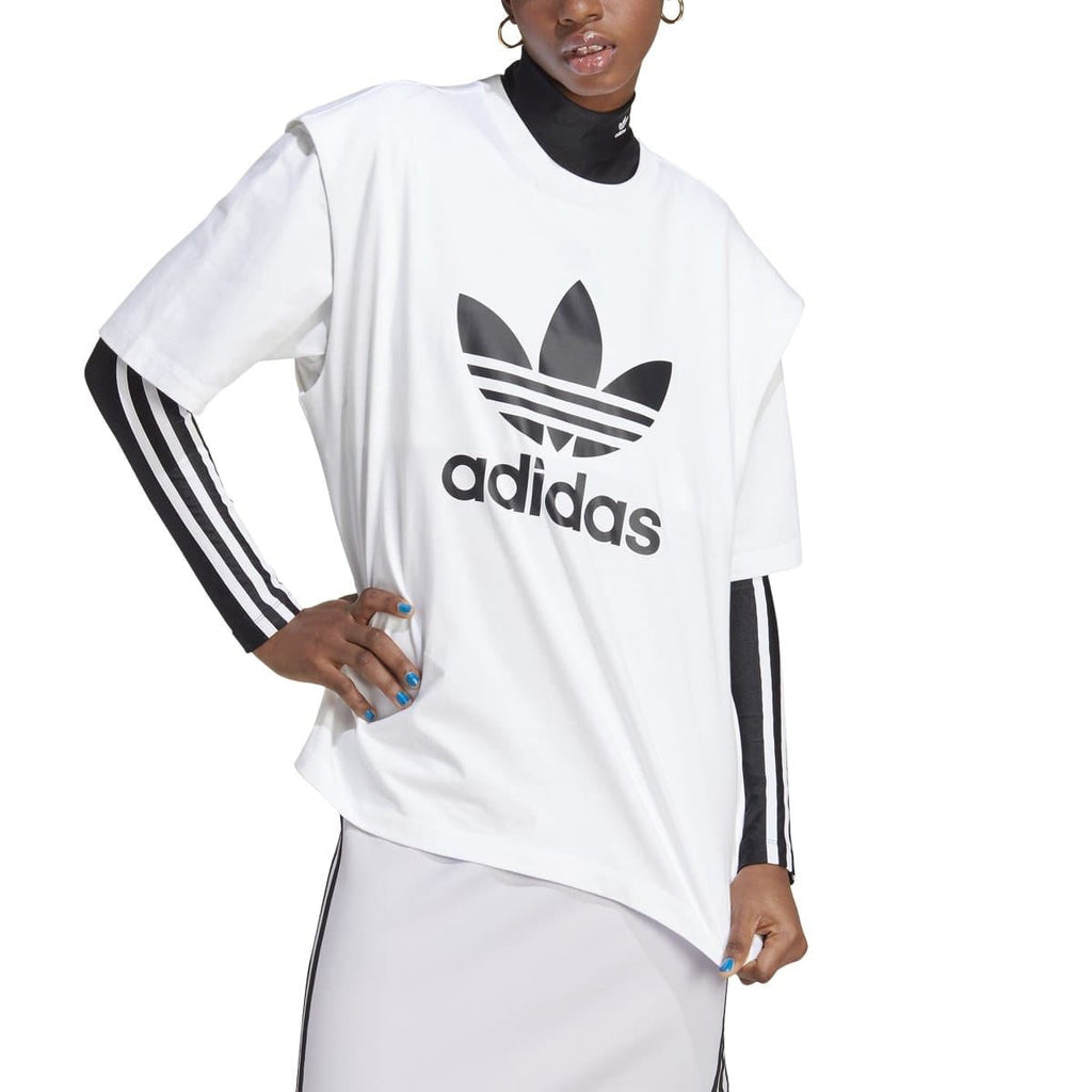 White adidas Originals T-shirt on model with black trefoil logo and adidas wordmark