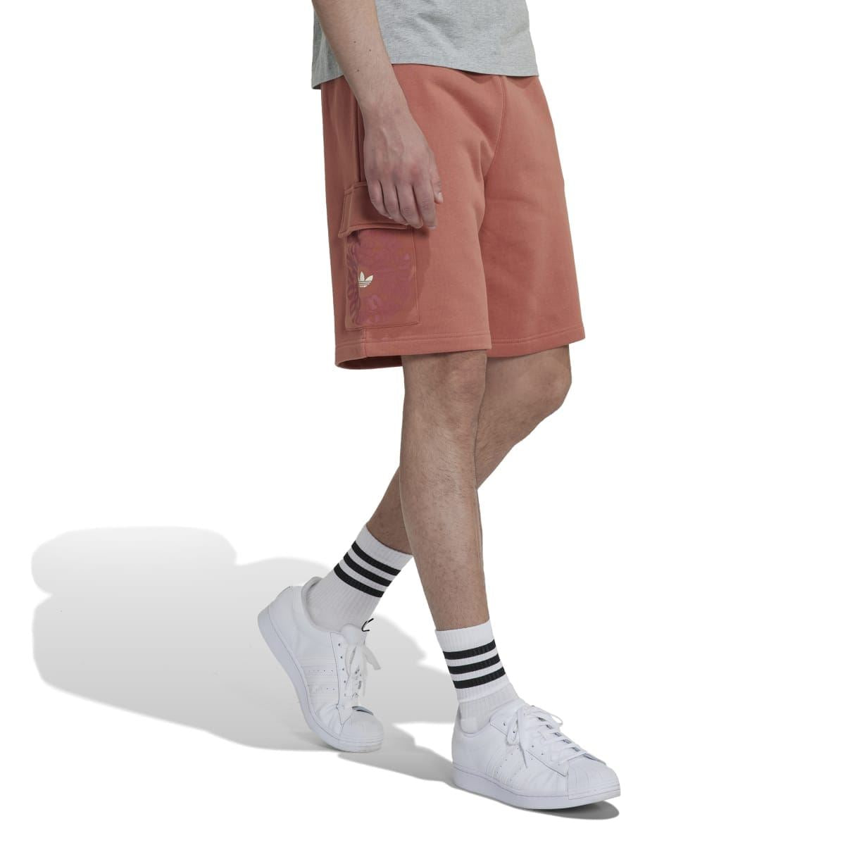 Rust-brown cargo shorts side view with flap cargo pocket and above-knee hem