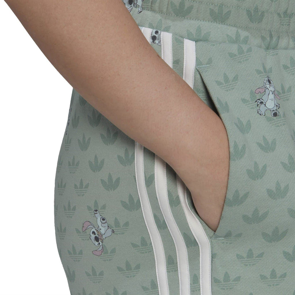 Mint green sweat shorts side close-up with three adidas stripes and character print