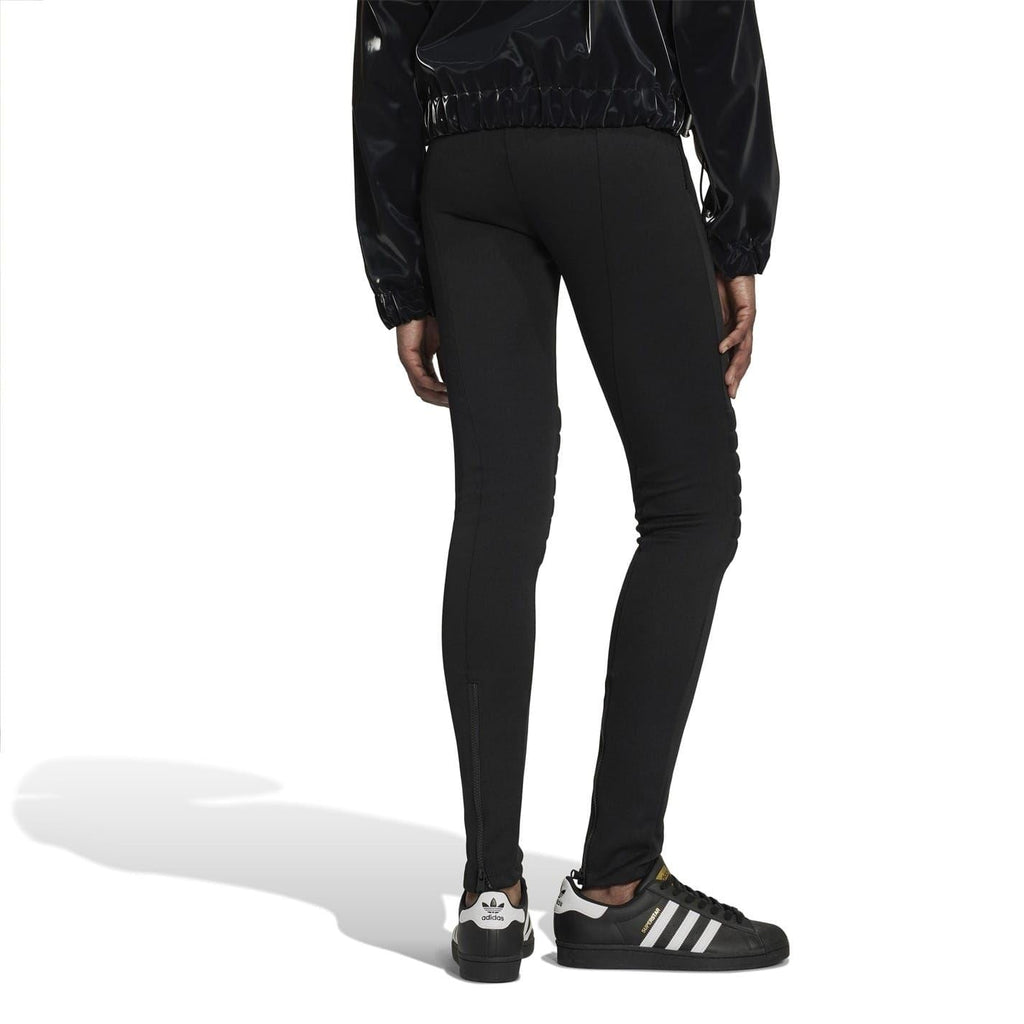 Black performance tights with tapered legs and quilted lower-leg design