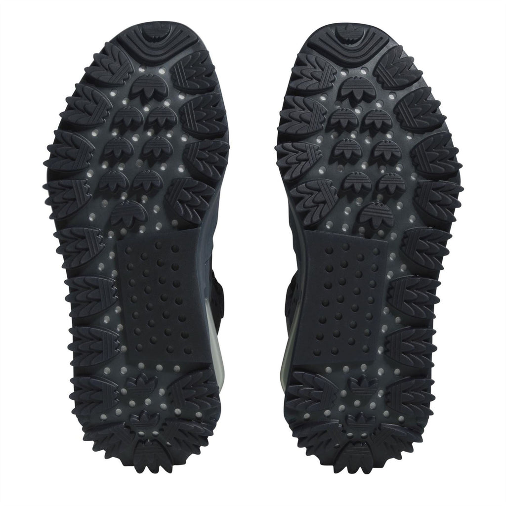 Altered Blue sneaker outsole view with deep tread and textured traction nubs
