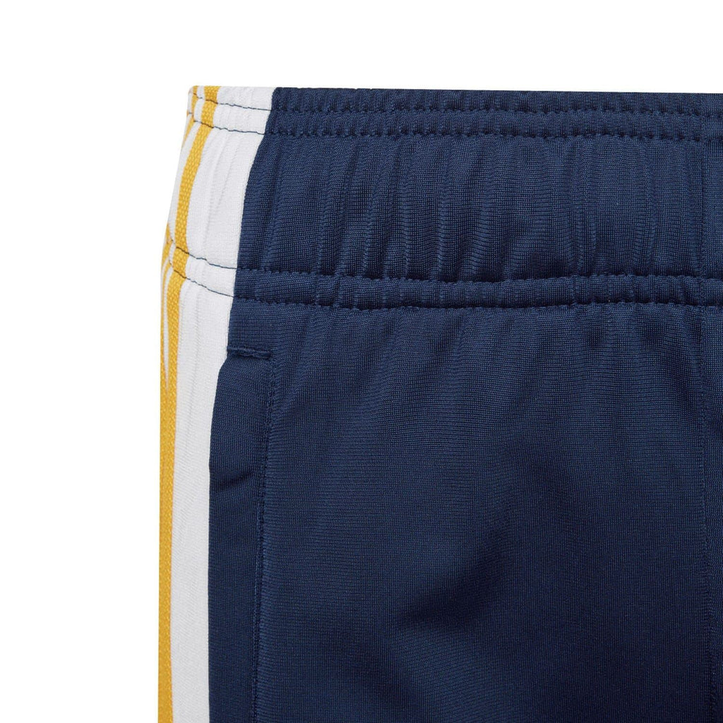 Elasticated waistband on navy juniors shorts with white-and-yellow stripe trim