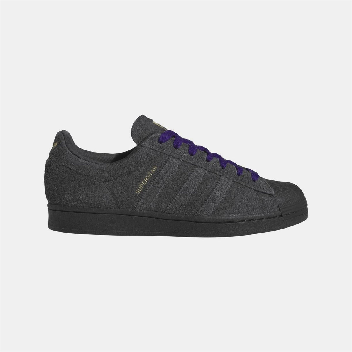 Black low-top Adidas Originals sneakers with purple laces and side stripe detail