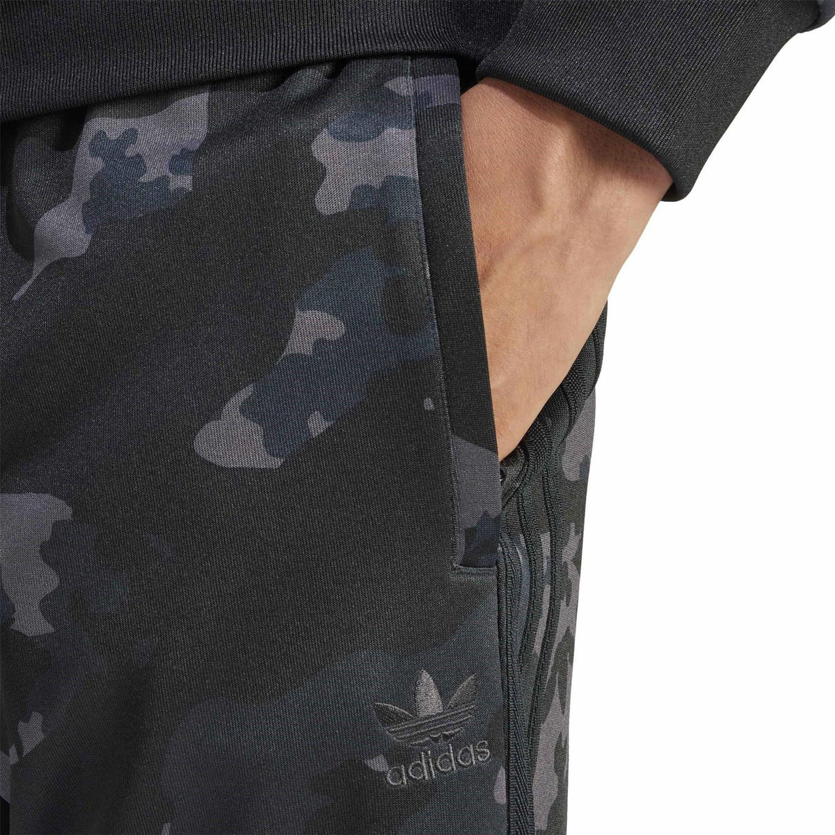 adidas Originals camo track pants close-up, adidas logo on leg and elastic hem
