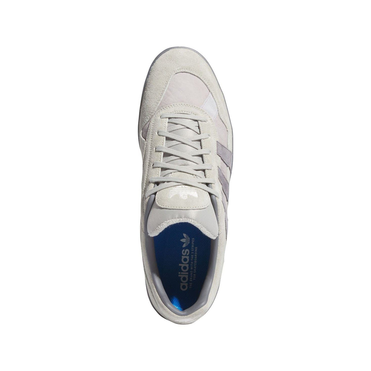 Beige adidas sneaker upper with lace-up, rounded toe, and logo at tongue