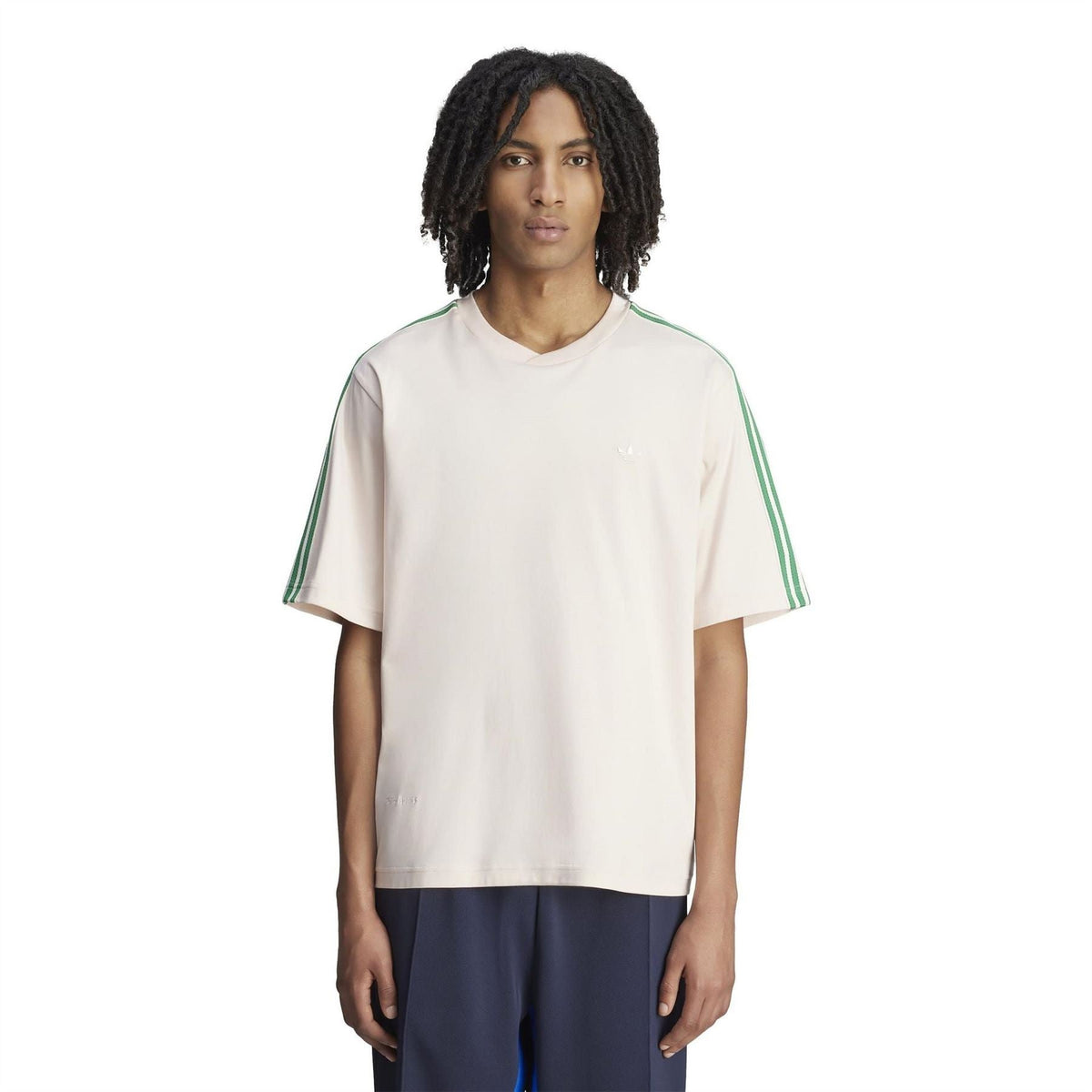 Cream logo T-shirt with green sleeve stripes; short-sleeve crew neck on model