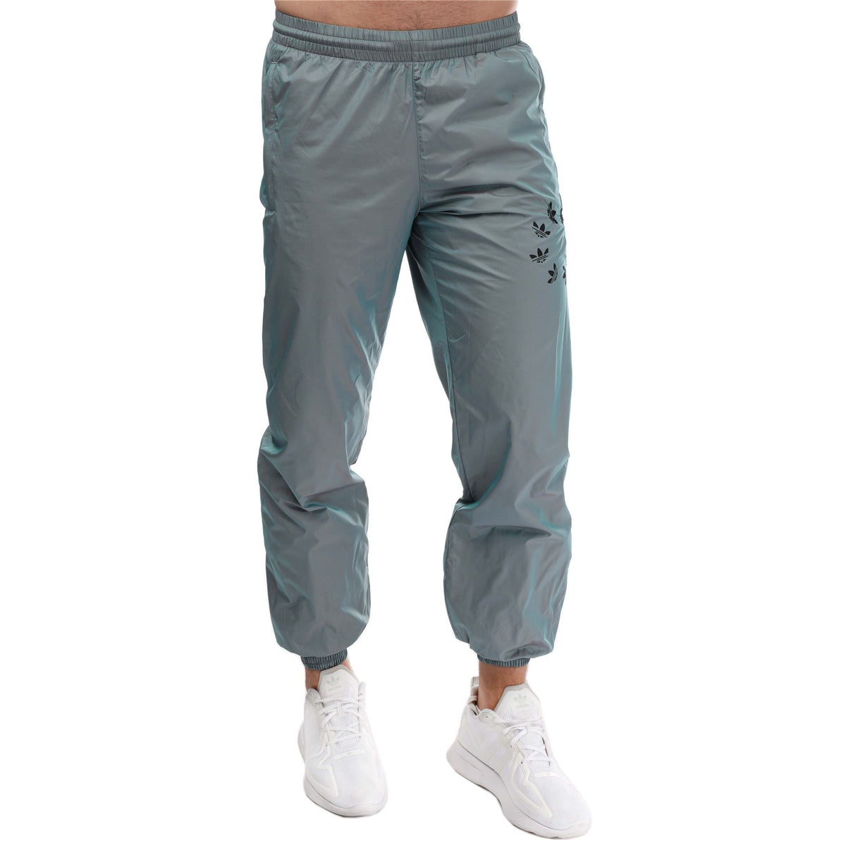Light blue track pants with elastic waistband, cuffed legs, and small side logo