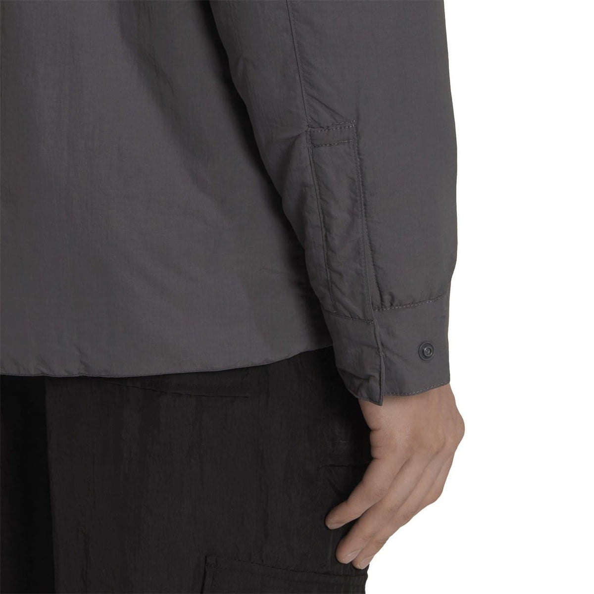 Grey adidas Originals zip-up shirt-jacket side view with button cuff and pocket detail
