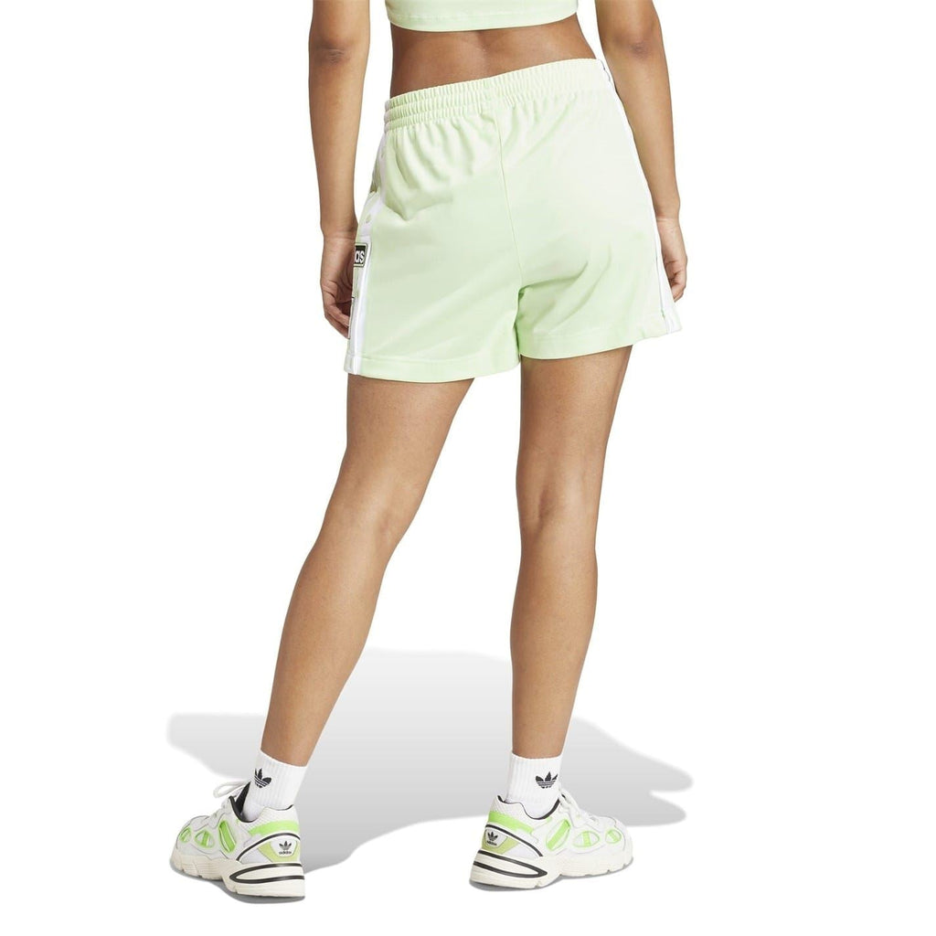 Light green Bermuda shorts with elastic waist and white striped side detail