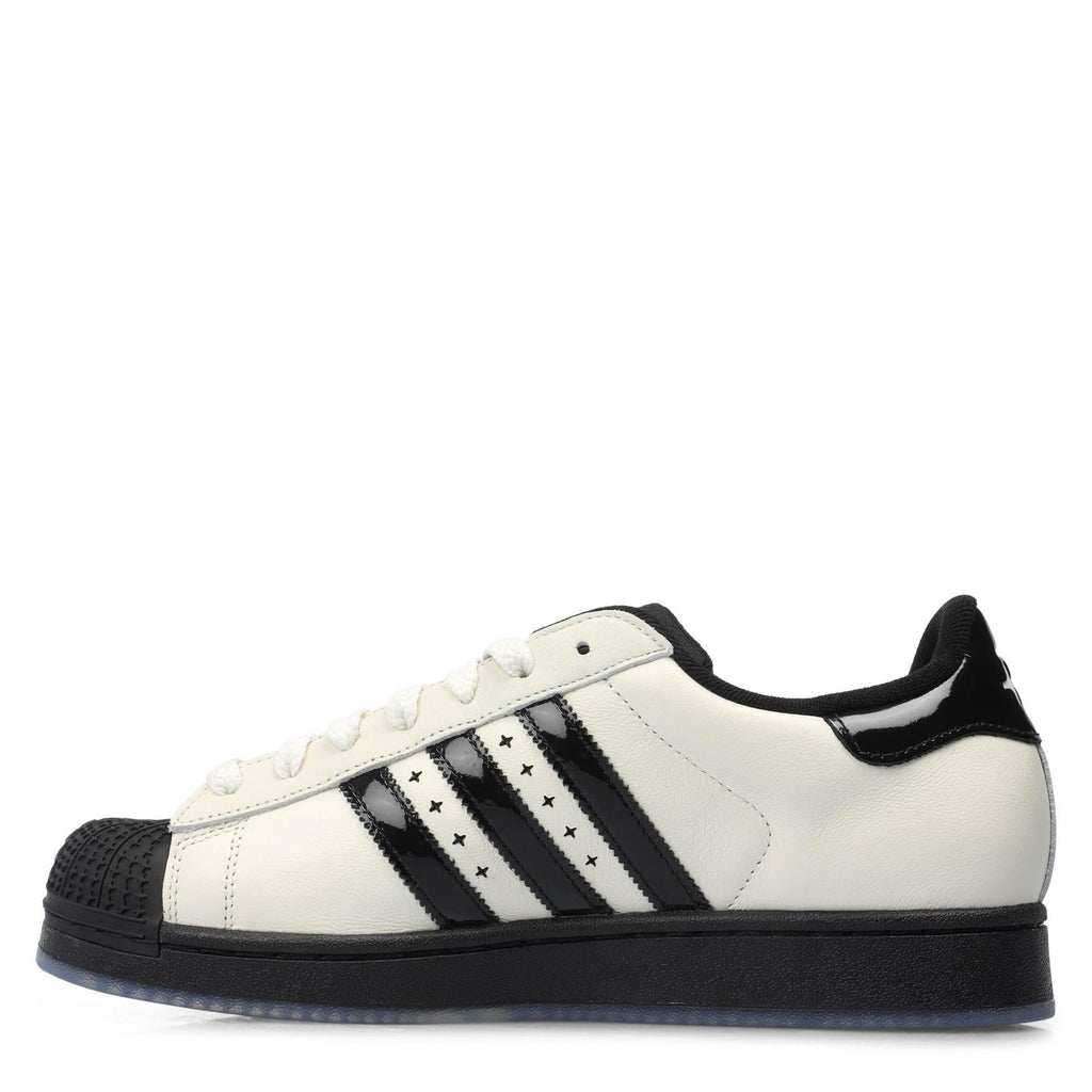adidas low-top sneakers, off-white leather with black rubber toe cap and three stripes