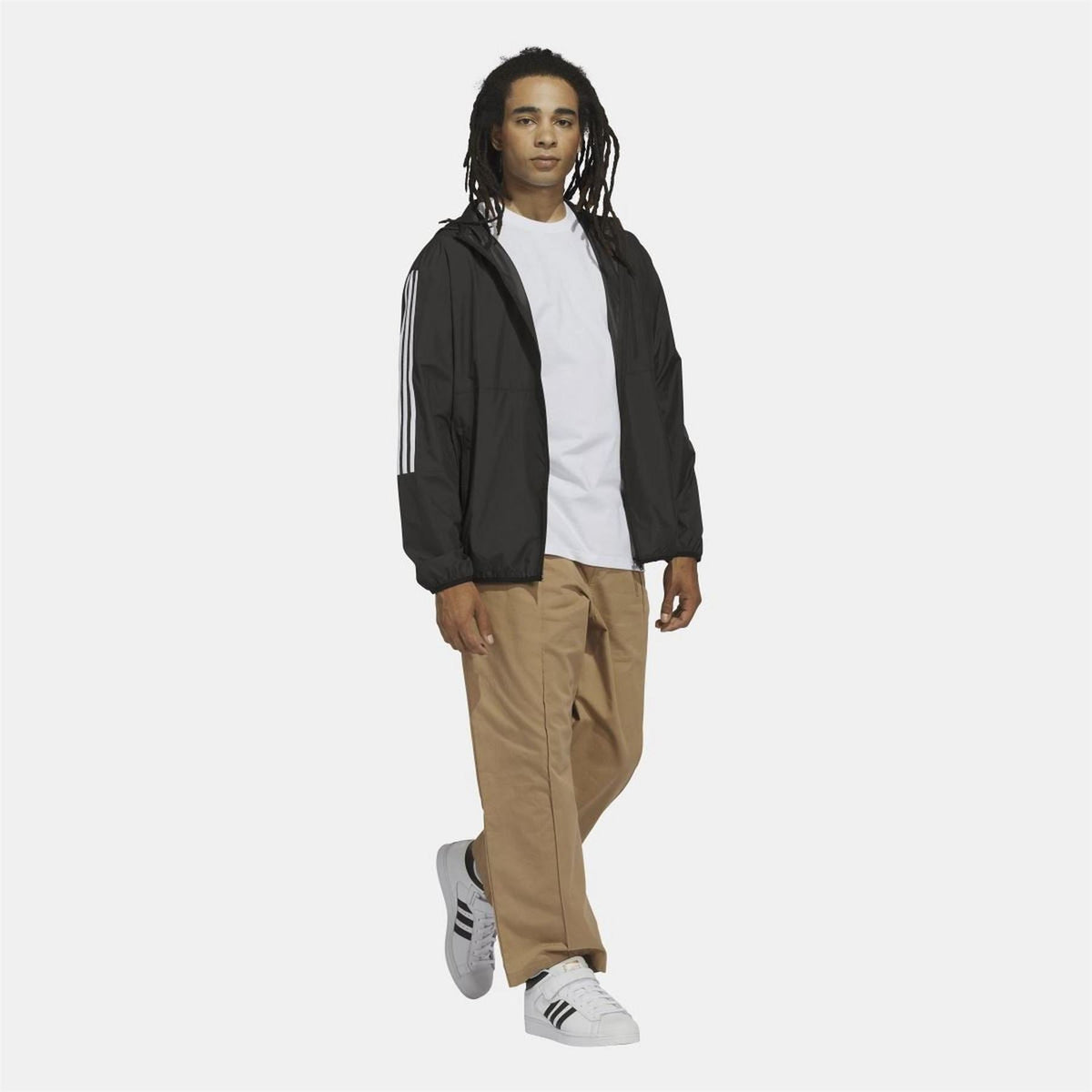 Black hooded windbreaker jacket with front zip and three white sleeve stripes