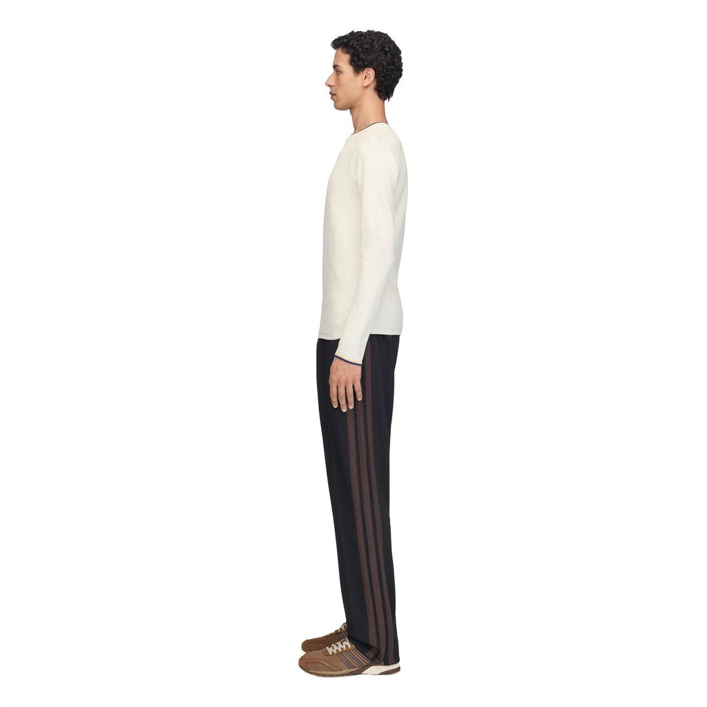 Cream knit long-sleeve top with navy and yellow trim at crewneck and cuffs