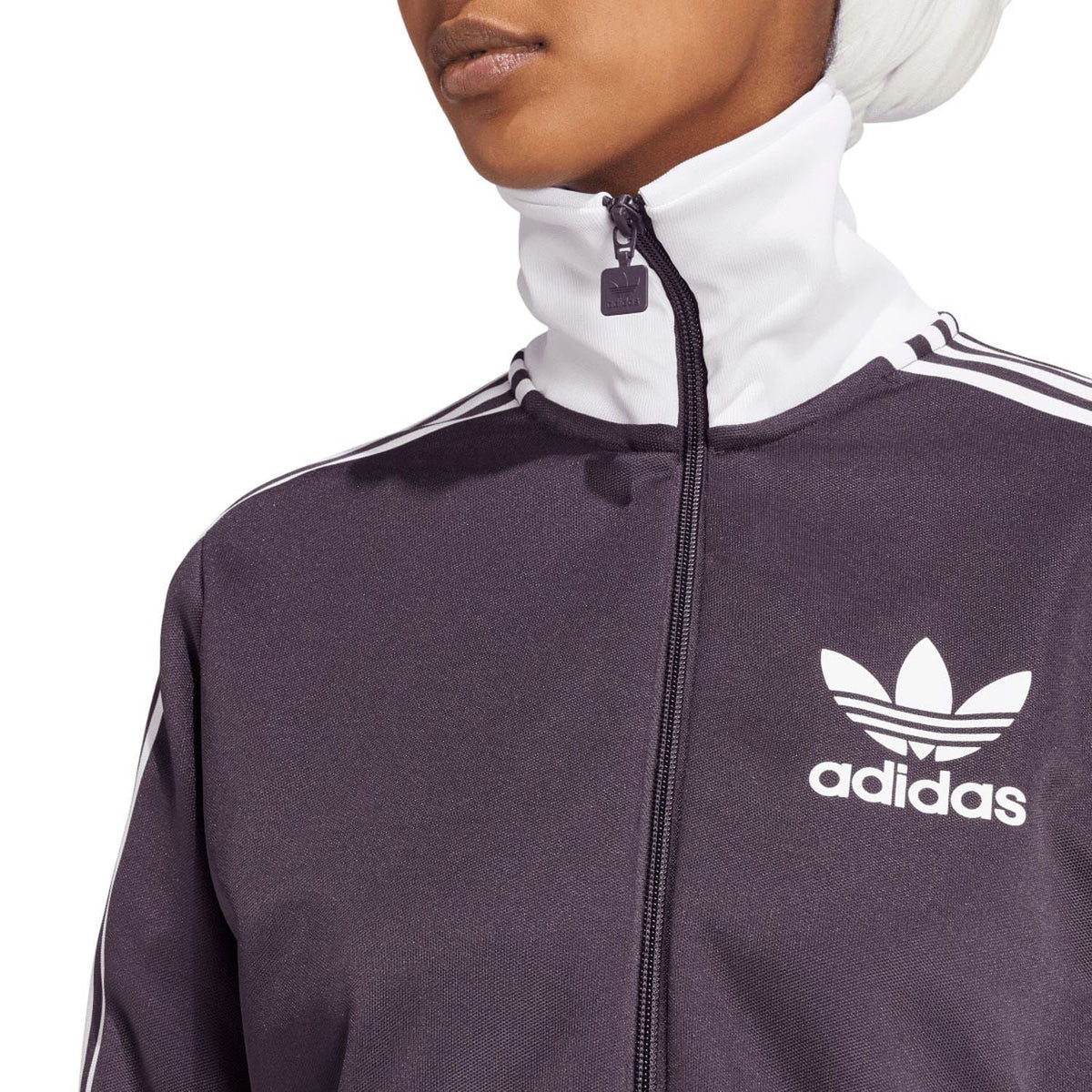 Dark purple track top with adidas trefoil logo on chest and white three stripes on sleeves