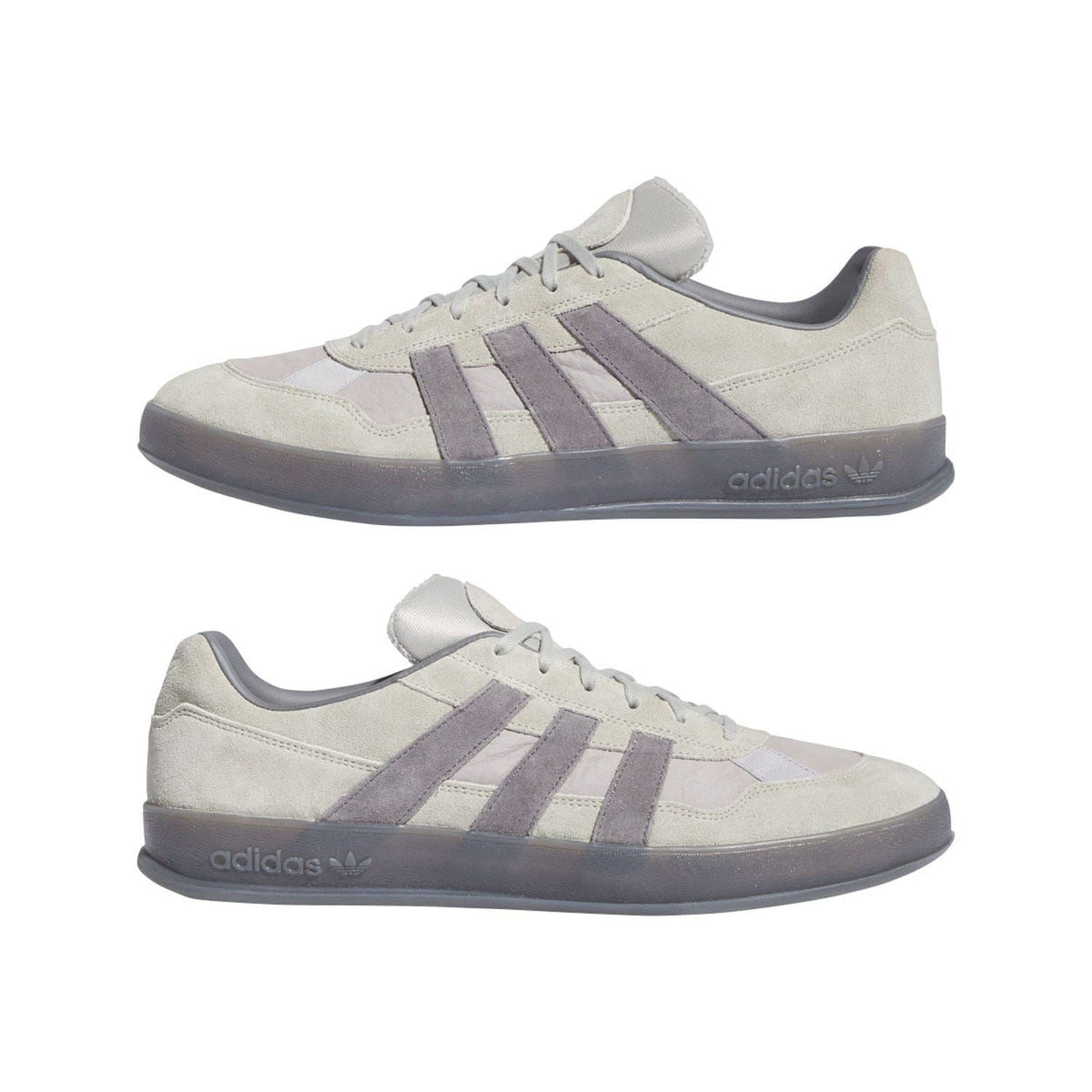 Pair of beige adidas Originals Aloha Super Trainer sneakers with purple stripe details