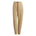 Beige adidas Originals sweatpants with elastic waistband and red drawcord