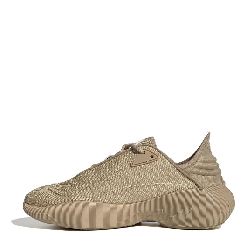 Beige low-top trainers with lace-up knit upper and molded side details