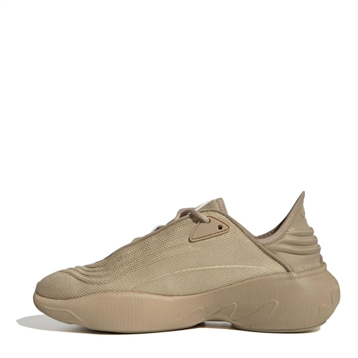Beige low-top trainers with lace-up knit upper and molded side details