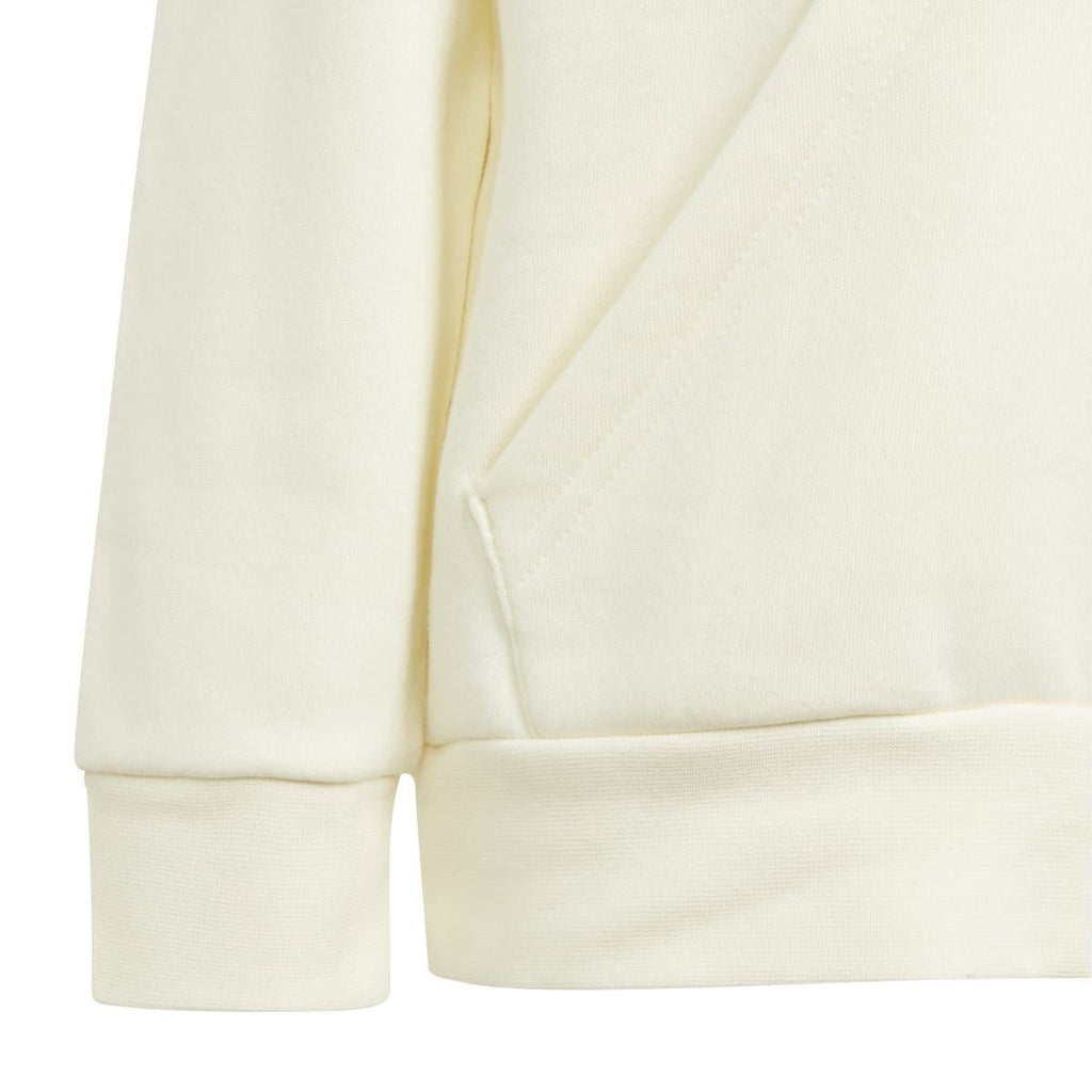 Kids' cream tracksuit fabric close-up: sleeve and hem cuff detail