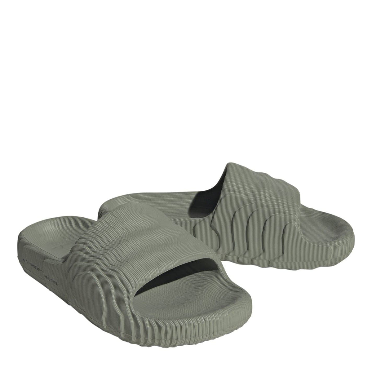 adidas Originals Adilette 22 textured slide sandals in black with a cushioned footbed and textured strap for comfort and style