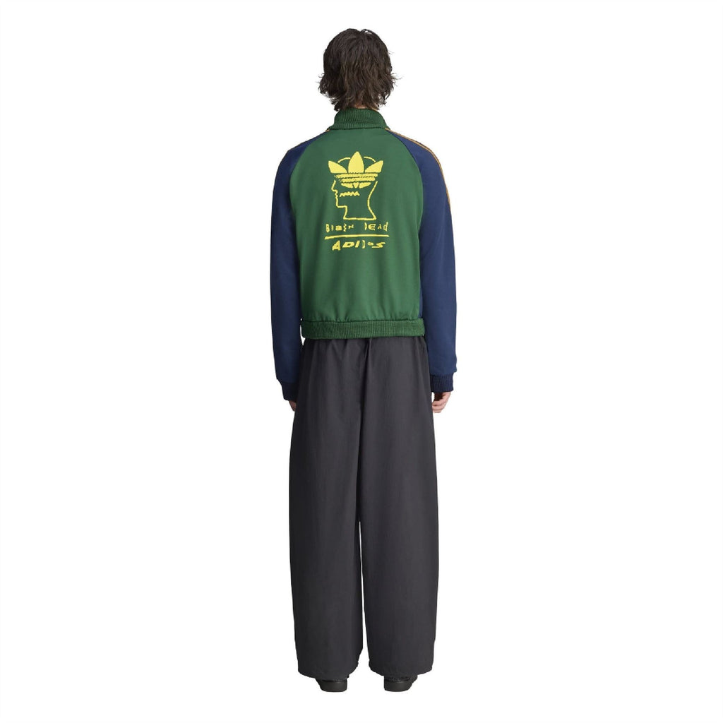 Back view of green track top with large neon yellow graphic and gold trim