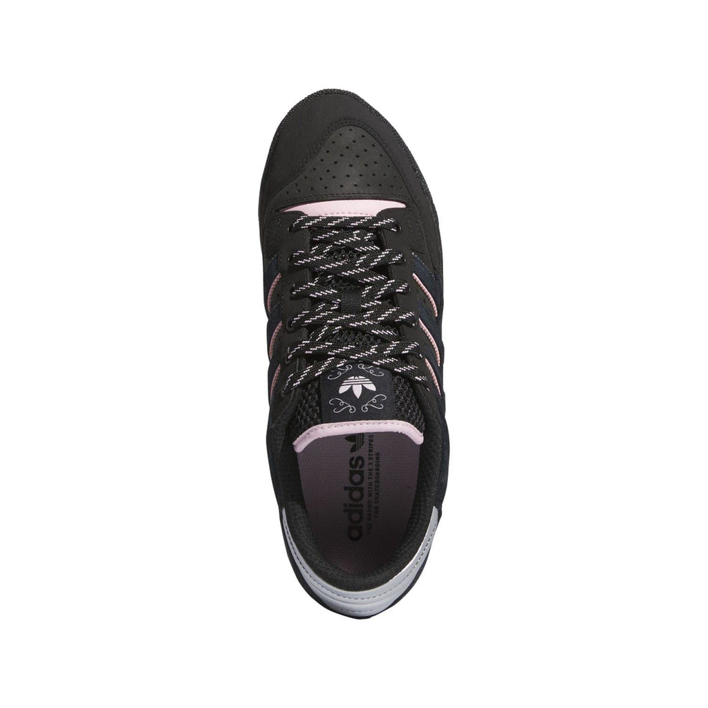 Black lace-up sneaker with pink collar trim and adidas logo on the tongue