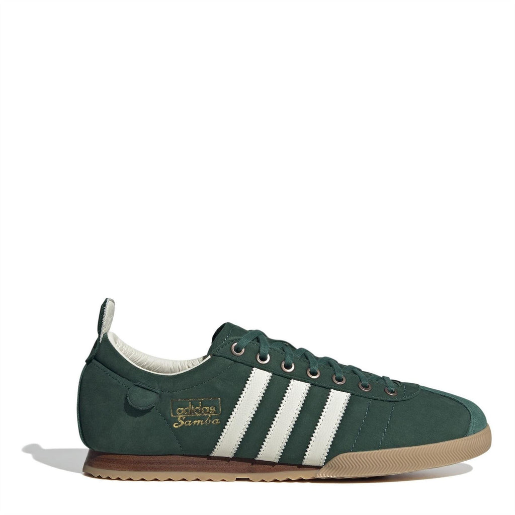 Green suede low-top sneakers with white three-stripe details and lace-up front