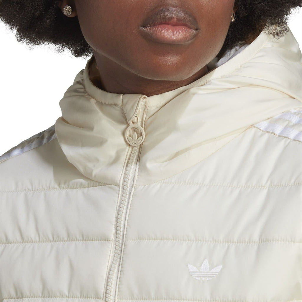 Light cream puffer jacket close-up: full zip, hood drawstring, adidas logo on chest.