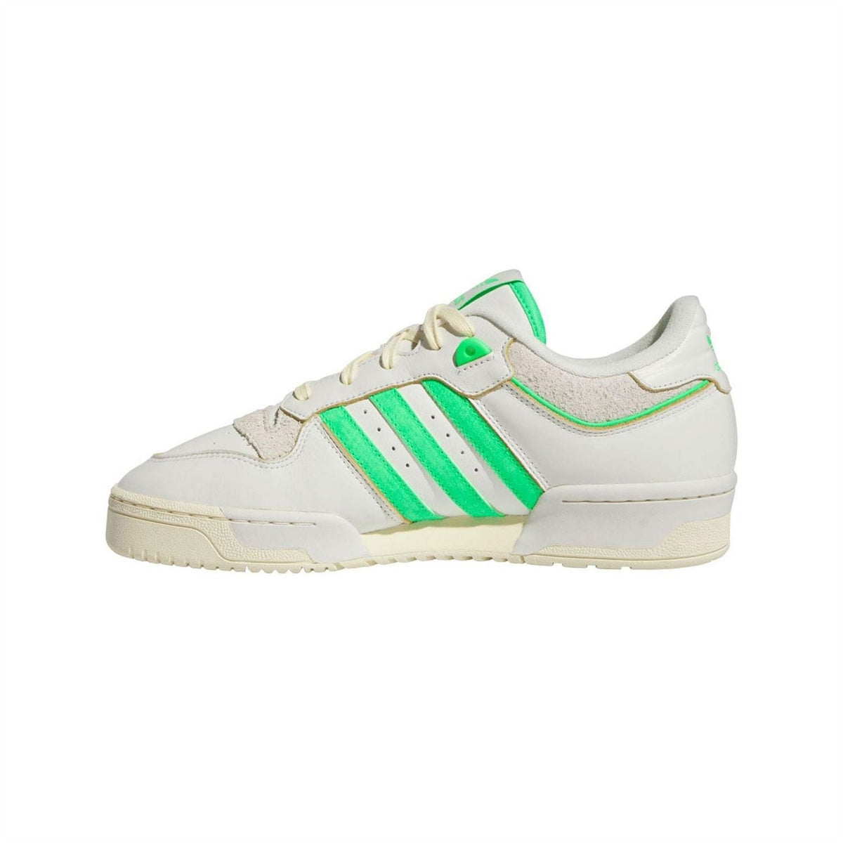 Low-top trainers in white with green three-stripe logo and lace-up front