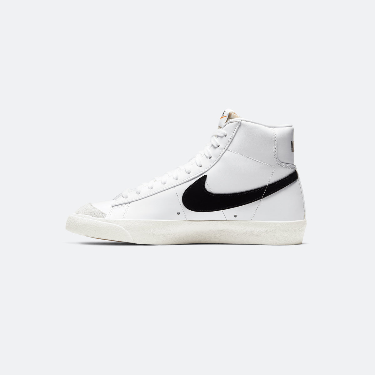 White Nike Blazer Mid '77 high-top sneaker with black swoosh and lace-up front