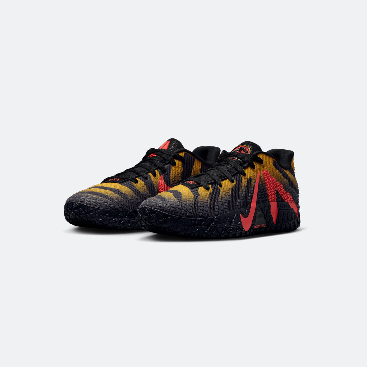 Black basketball sneakers with red logo, yellow wave pattern, and lace-up design