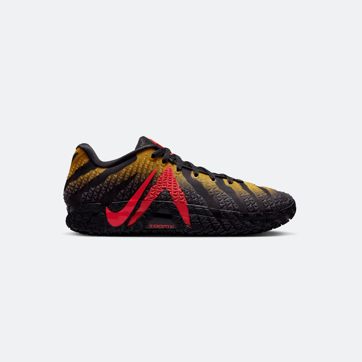 Black basketball sneakers with red swoosh, yellow pattern, and chunky textured sole