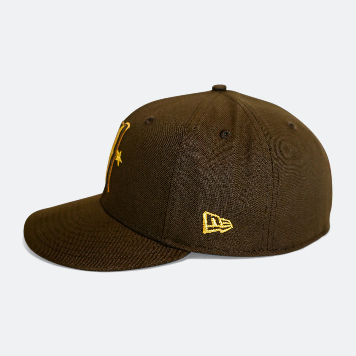 Brown 59Fifty cap with gold New Era flag logo on side