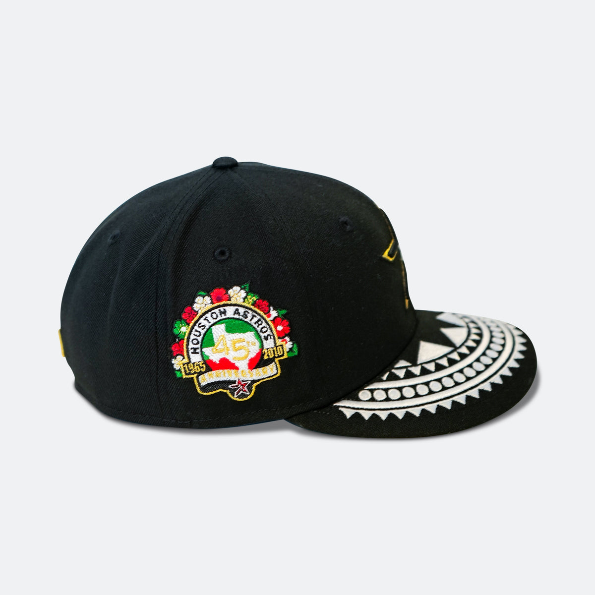 Black baseball cap with multicolor Houston Astros crest and patterned white brim