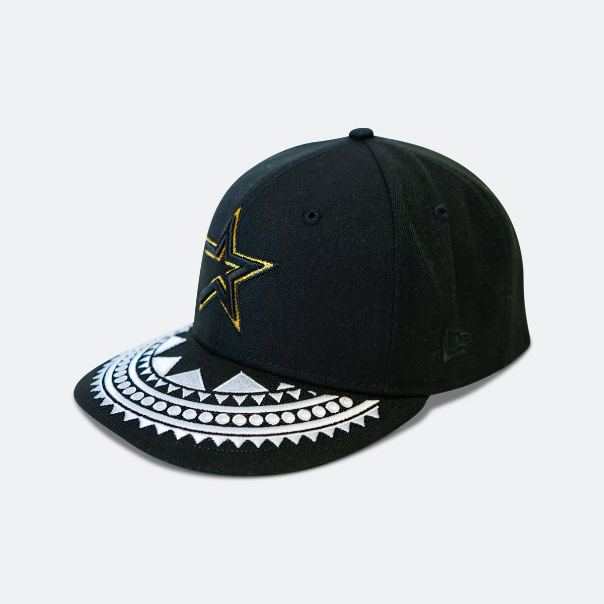 Black baseball cap with partial gold star and white patterned brim