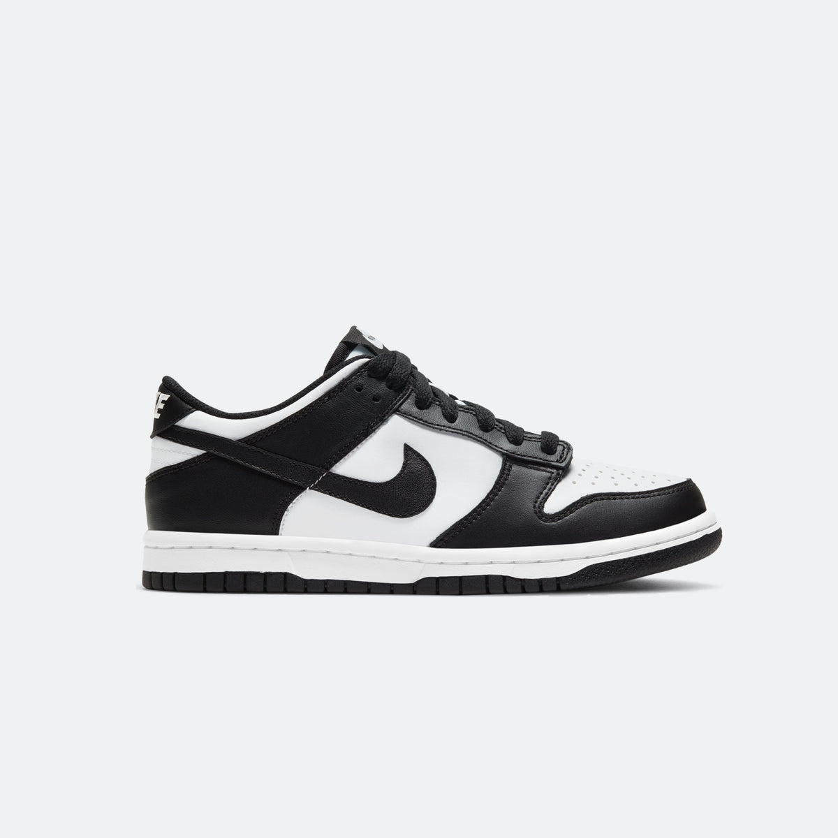 White and black low-top sneakers with black Swoosh logo and lace-up front