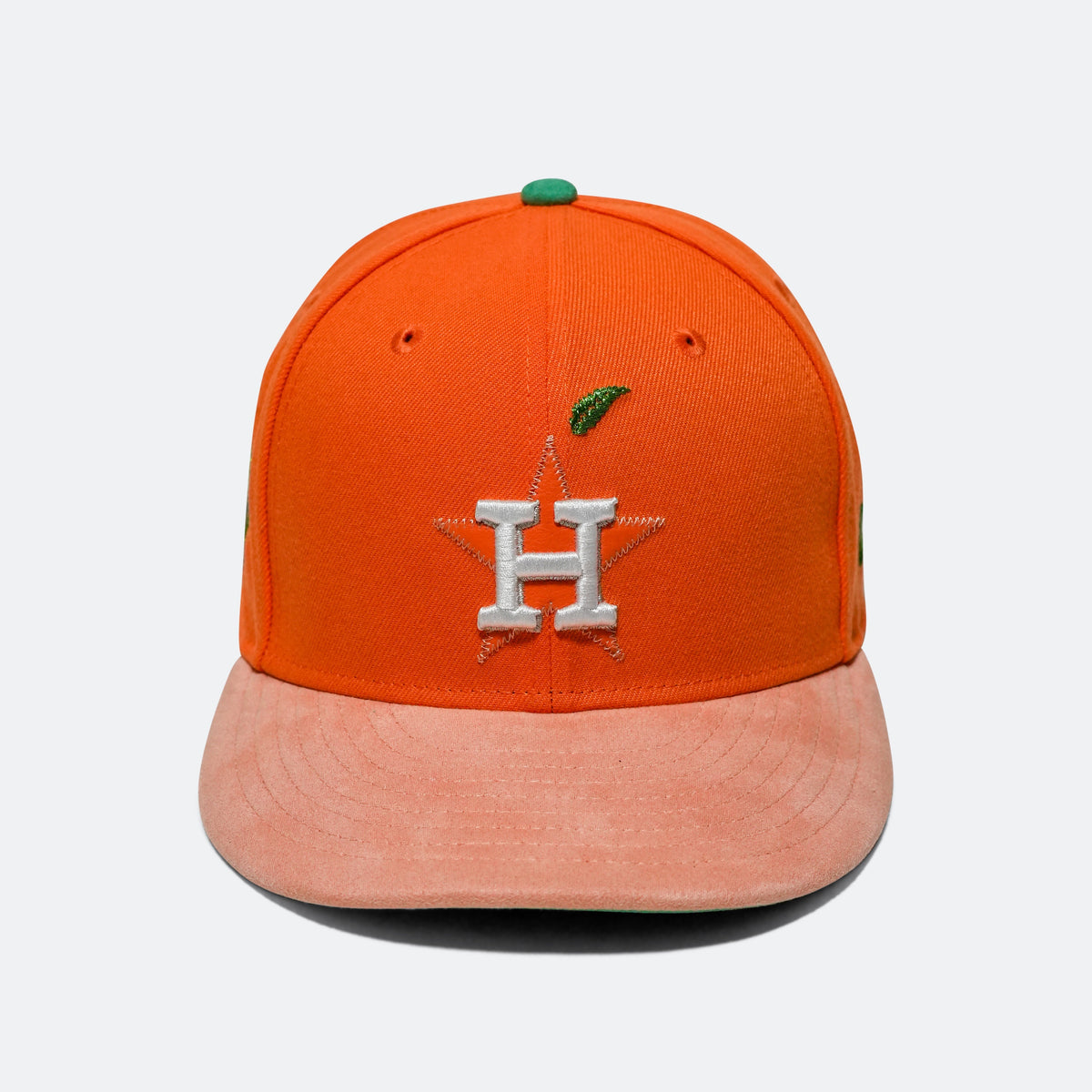 Orange baseball cap with green top button, silver 'H' logo, pink brim