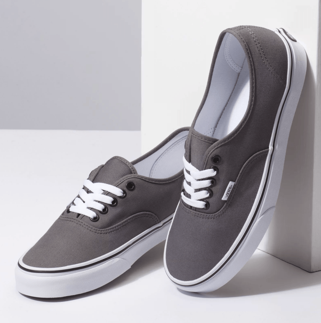 Grey canvas low-top sneakers, lace-up design with white laces and rubber sole