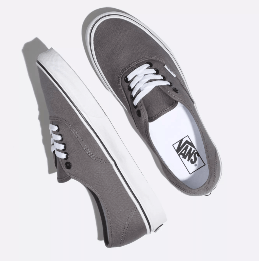 Grey canvas sneakers with white laces and white vulcanized sole, Vans logo tag