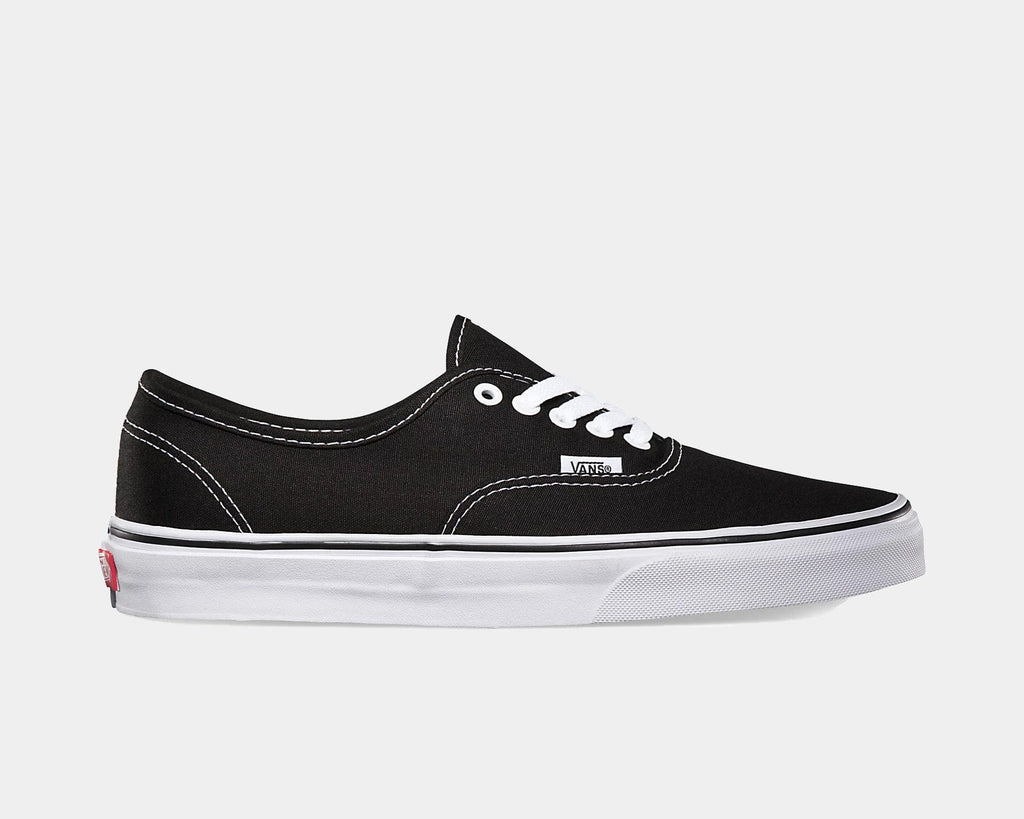 Black canvas low-top sneakers with white laces and white rubber sole