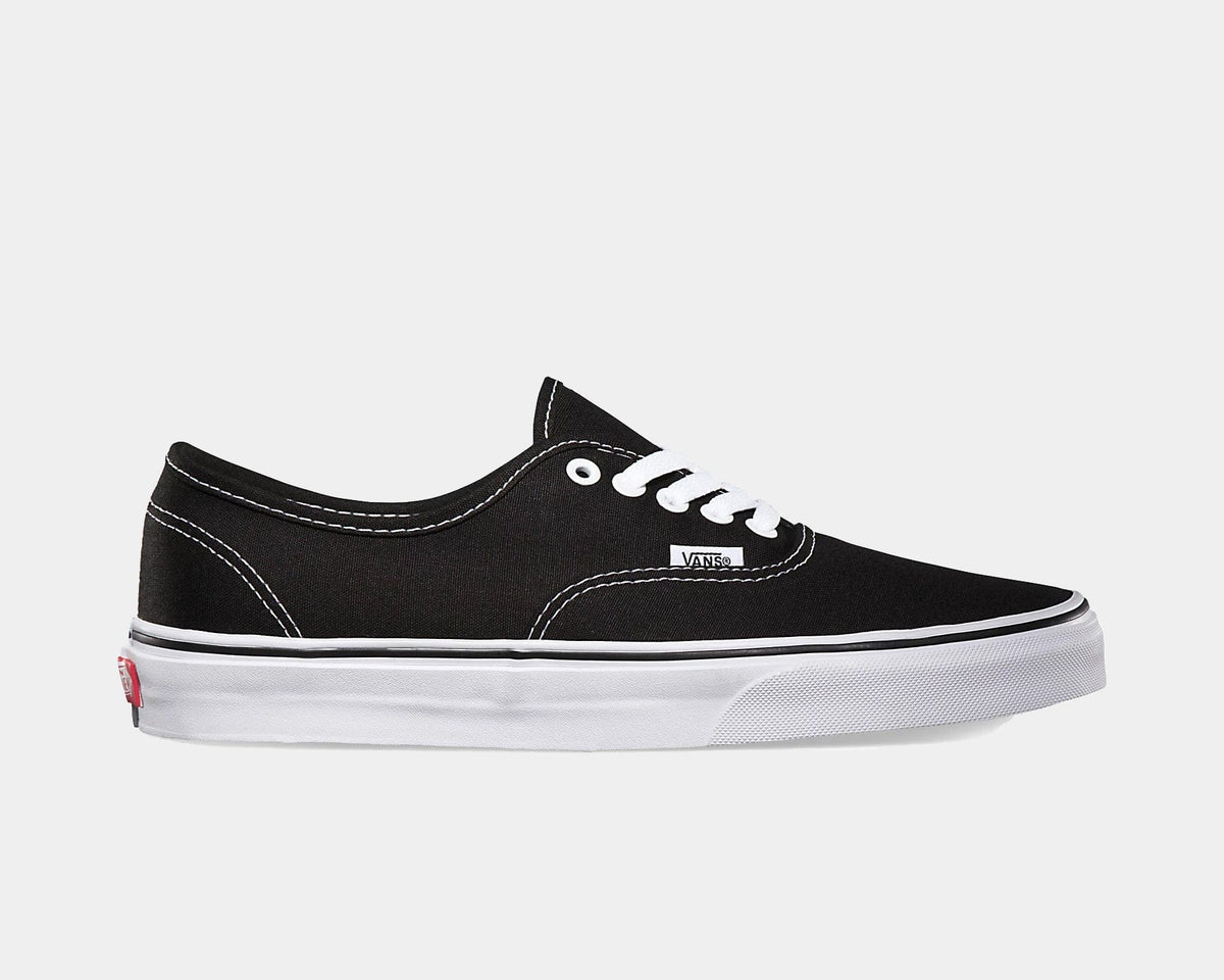 Black canvas low-top sneakers with white laces and white rubber sole