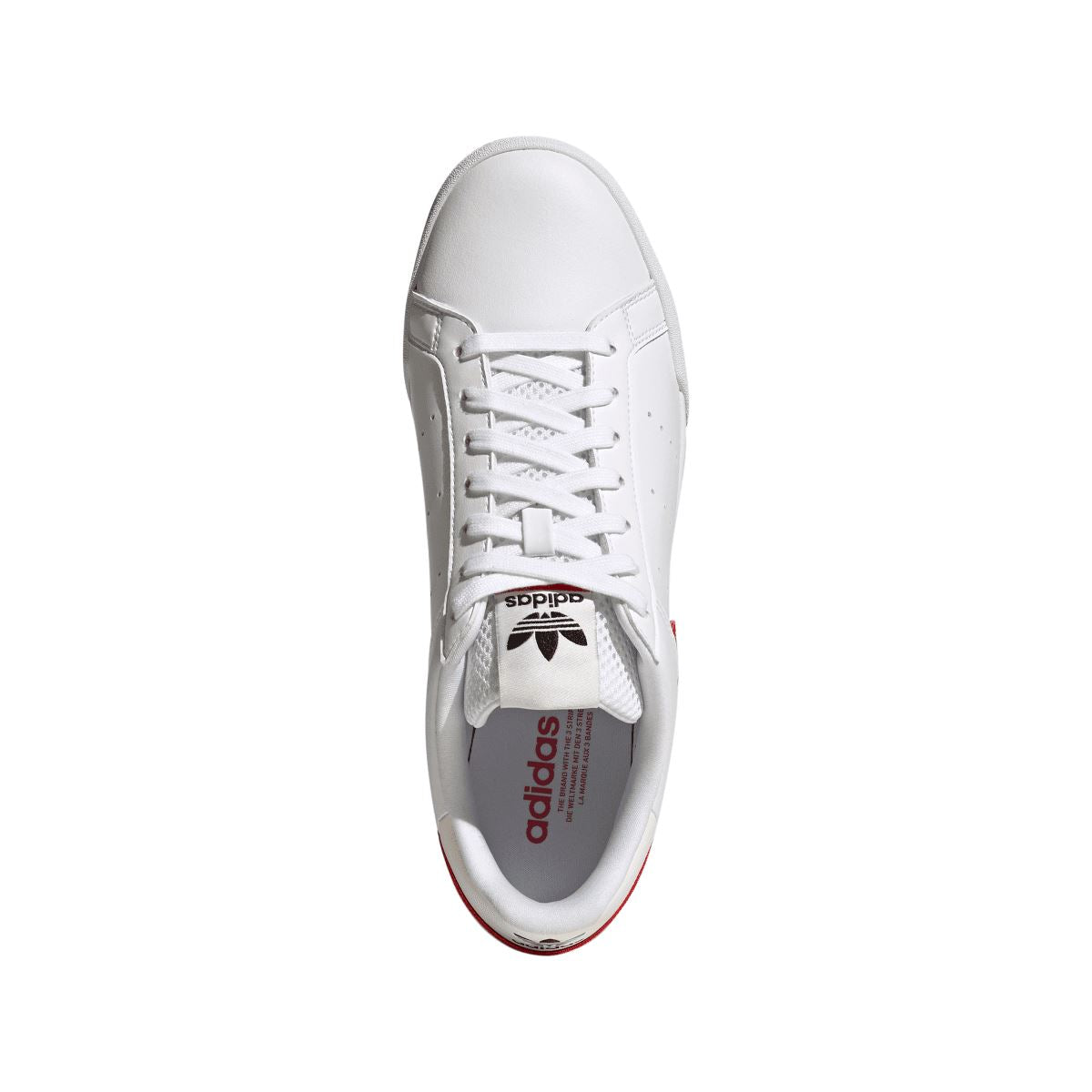 White lace-up sneaker with adidas tongue label and perforated detail