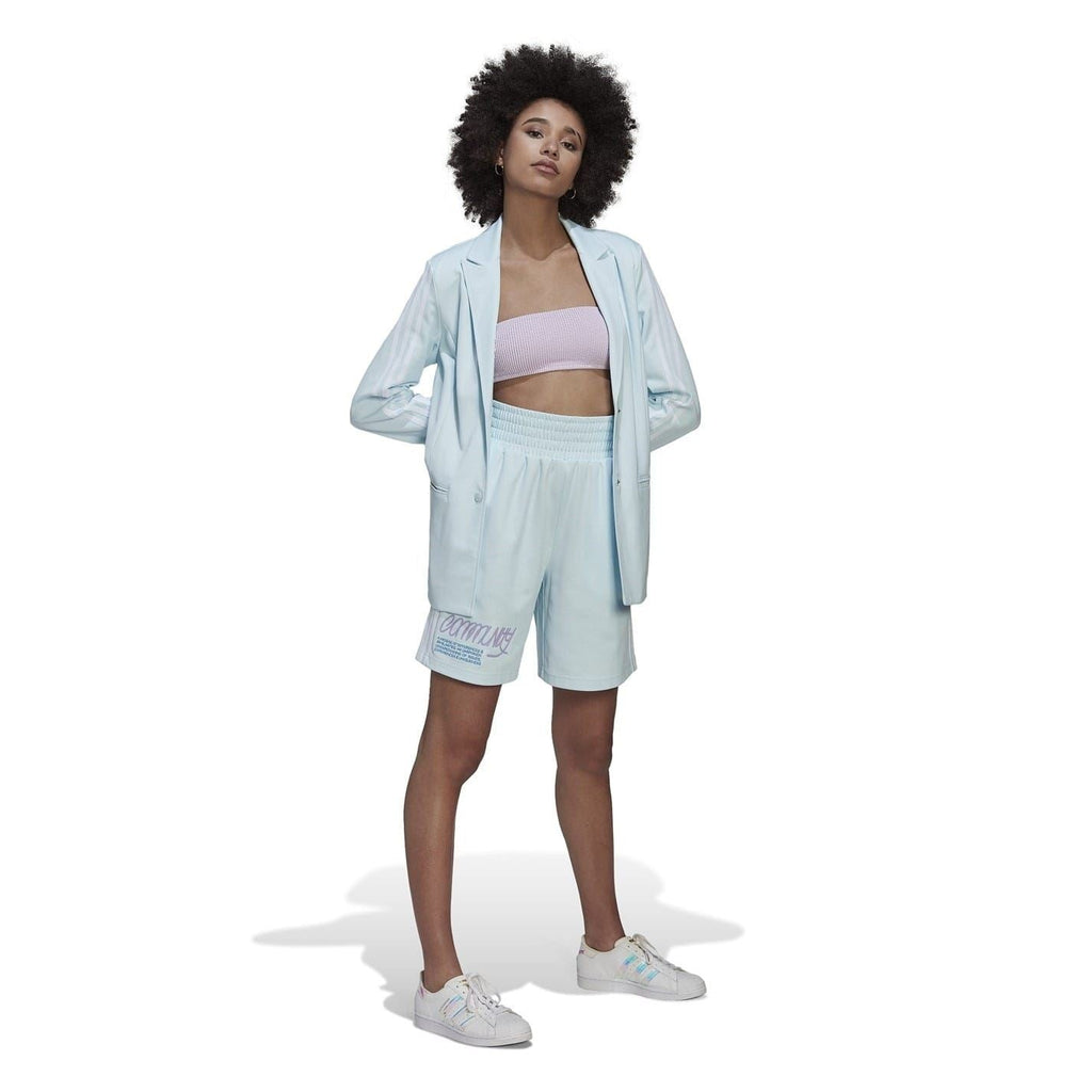 Light blue collared blazer jacket worn with matching shorts and crop top