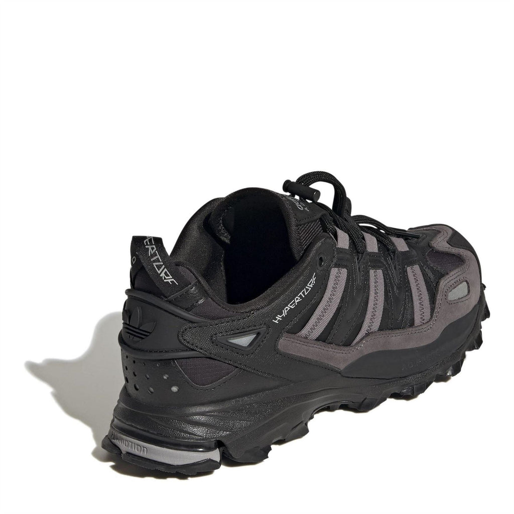 Black adidas sneaker heel with cushioned midsole and visible inner lining.