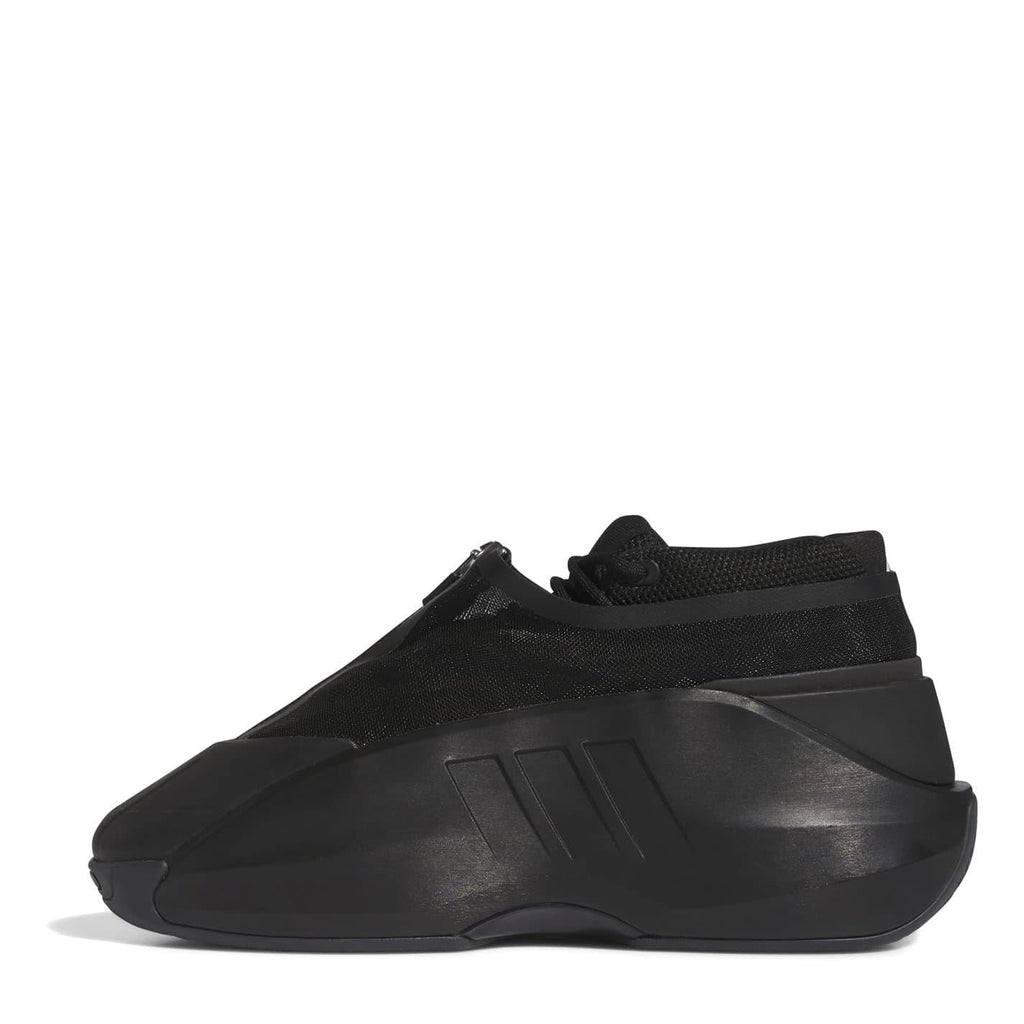 Black infant trainers with sock collar, strap detail, and molded midsole